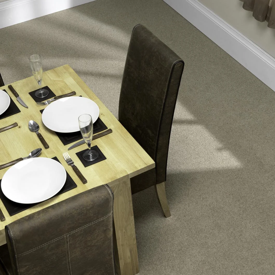 Textured carpet in a sunny dining space with a set table