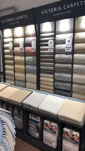 A Victoria Carpets sample stand with wool ranges