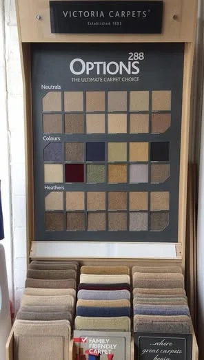 A carpet sample stand showing a wide grid of colours