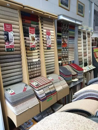 Sample stands with striped, plain and patterned carpets