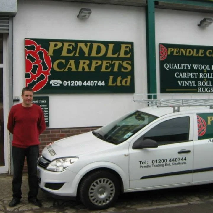 The original Chatburn shop with its green and gold sign and Pendle Carpets van