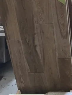 Close view of oak flooring samples in warm mid and light tones